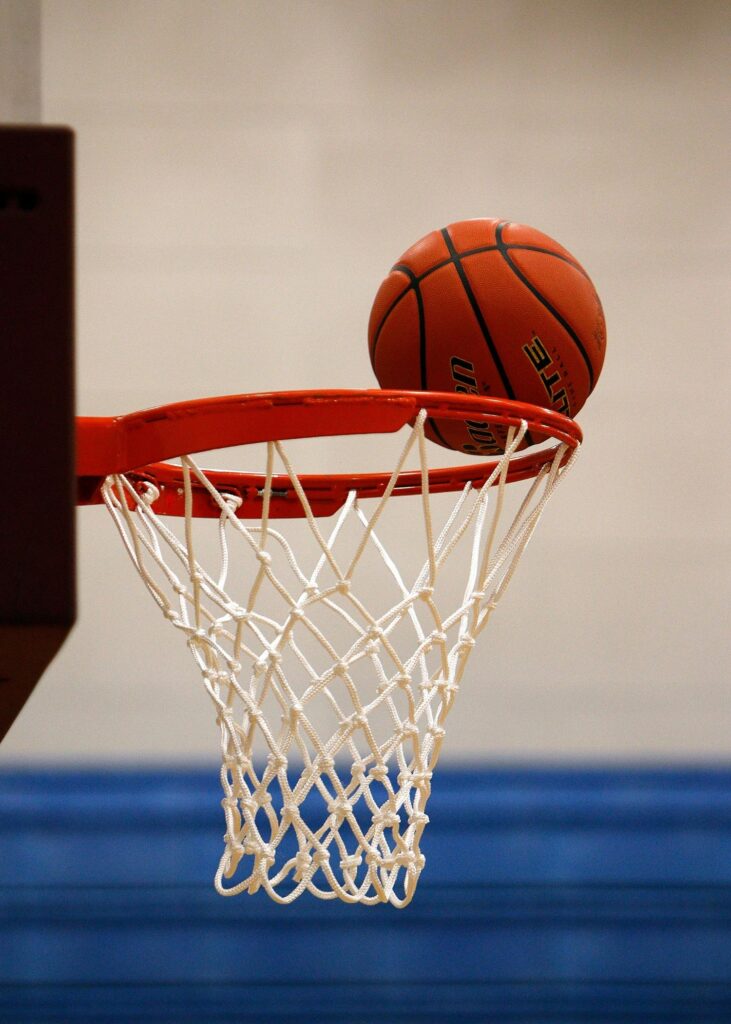 pexels-photo-358042-358042 A basketball moment captured as the ball rests on the rim, highlighting the suspense of the game.