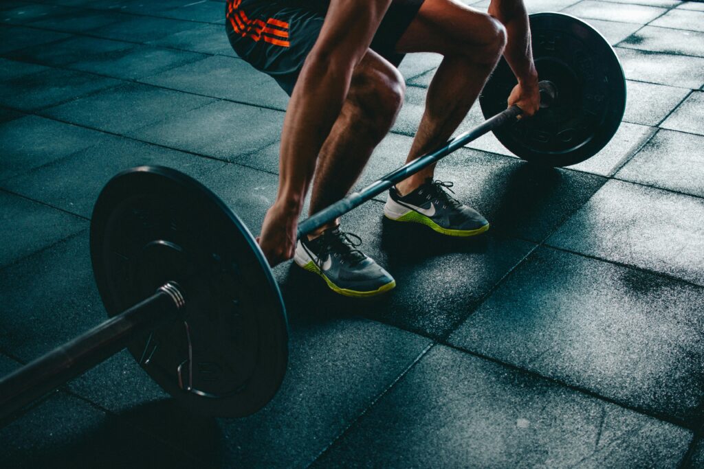 pexels-photo-841130-841130 Person Holding Barbell